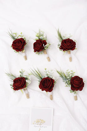 Ansofi wine-red boutonniere worn on a suit for elegant wedding accessory