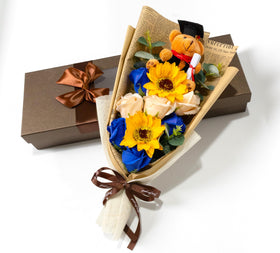 Ansuma graduation soap bouquet with roses and sunflowers; lasting fragrance for keepsake memories.