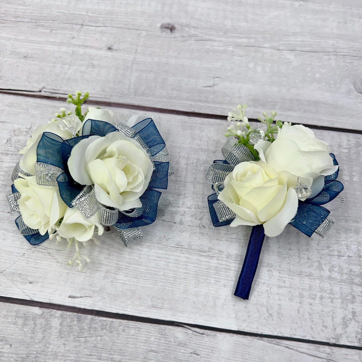 Ansuma ivory rose wrist corsage for wedding look and coordinated bridesmaids.