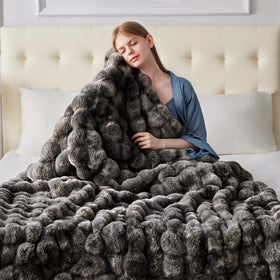 Anysay living-room scene with the blanket draped for instant comfort.