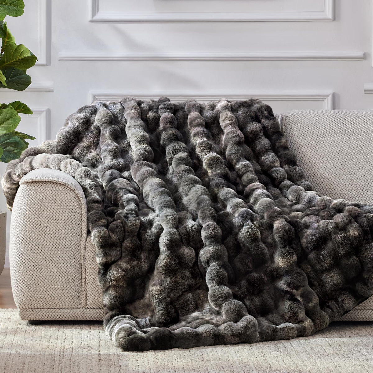 Anysay plush throw on couch demonstrates warm, inviting decor.