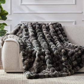 Anysay plush throw on couch demonstrates warm, inviting decor.