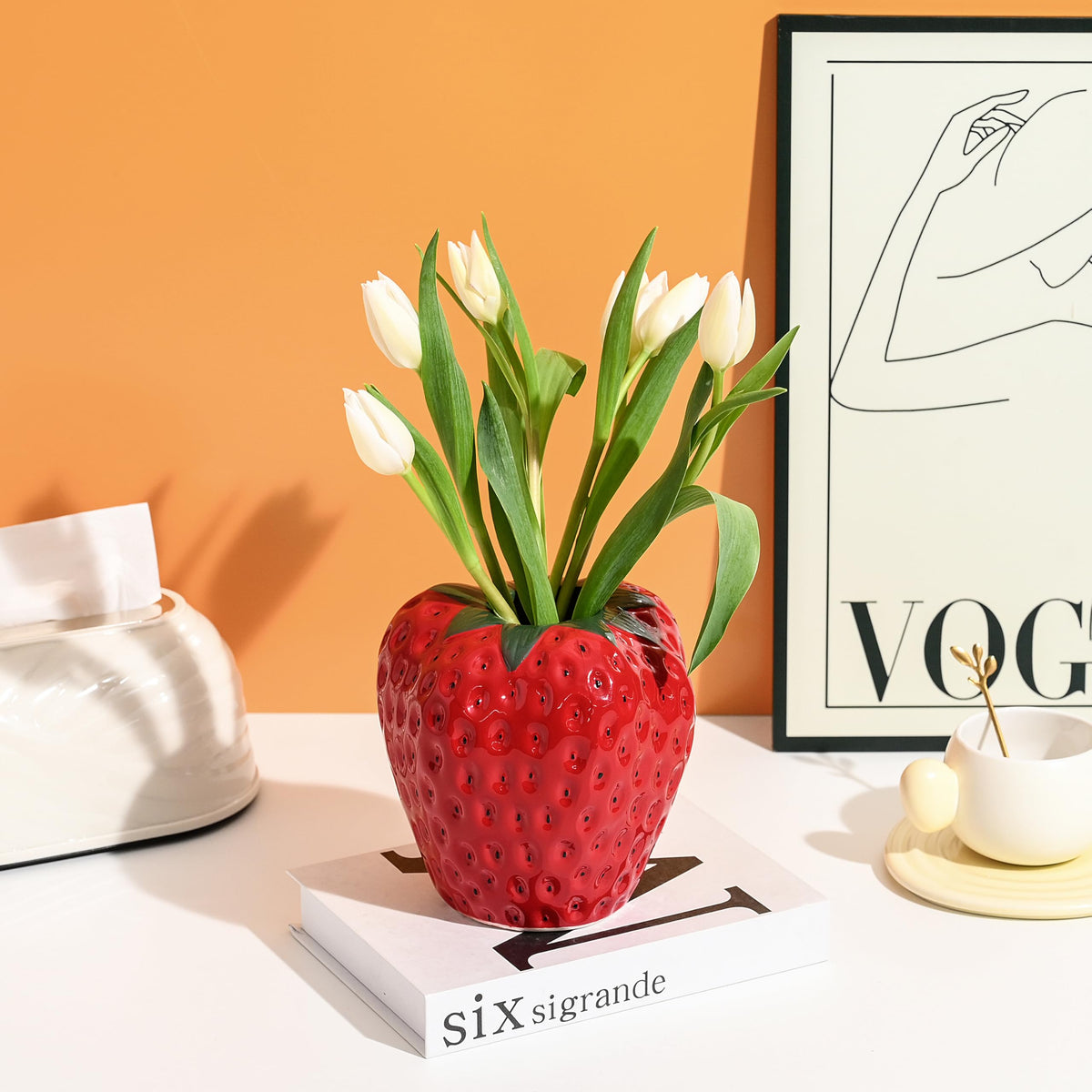 AOMOONOA strawberry vase on a bedside shelf provides a playful decor accent
