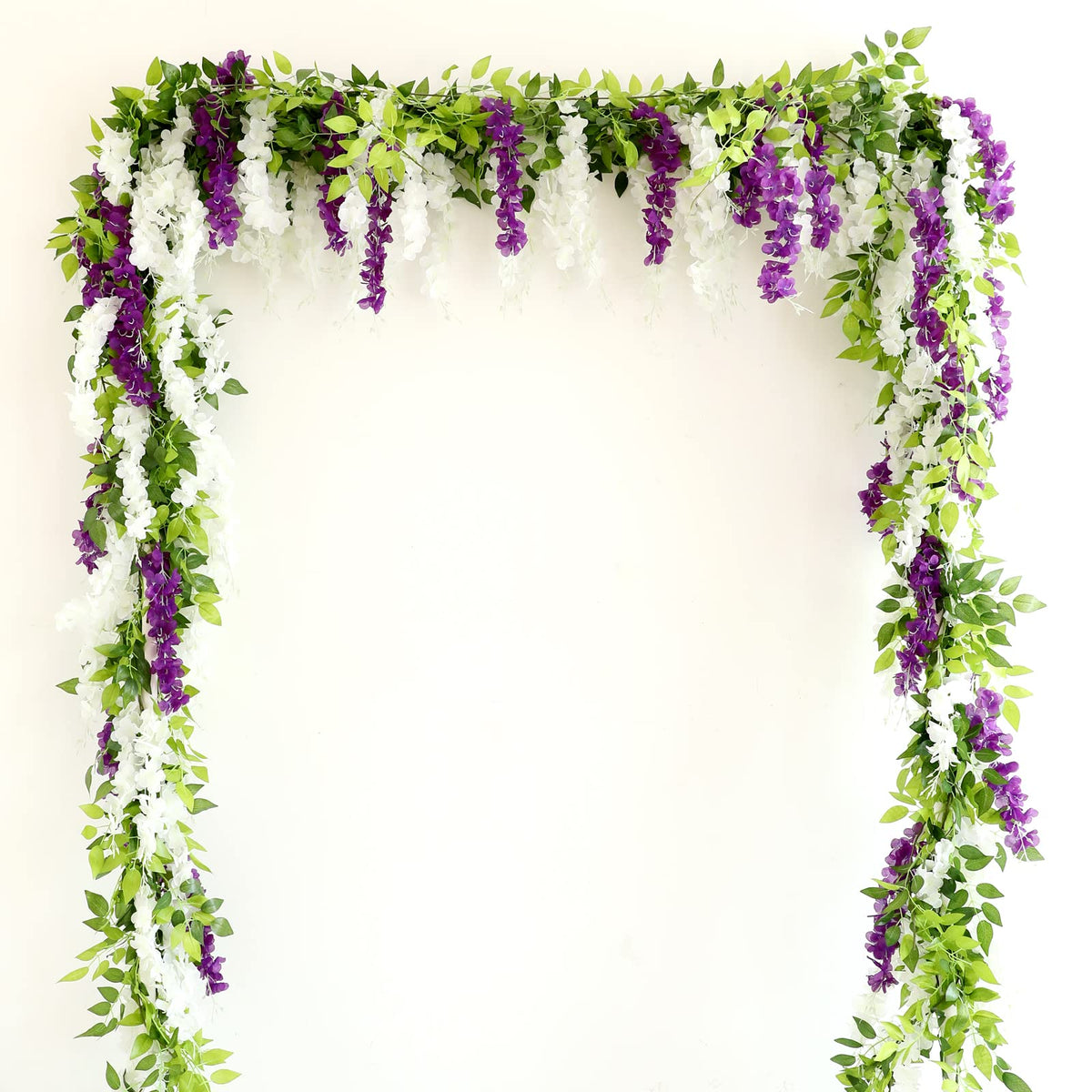 Apeair Wisteria garland on a table adding soft texture to dining spaces