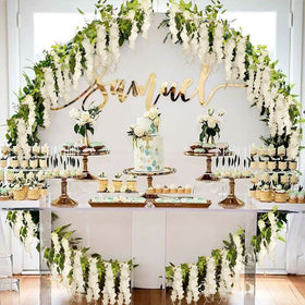 Apeair Wisteria garland on a wedding arch offering a romantic backdrop