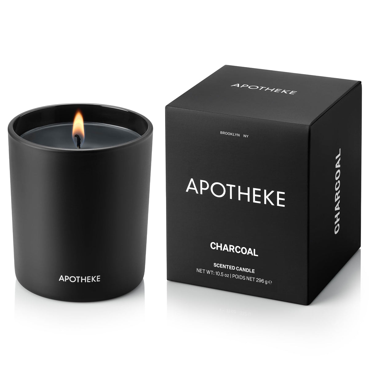 APOTHEKE Charcoal Classic Candle in a glass vessel enhances modern decor.