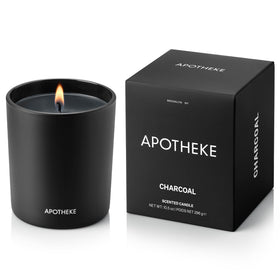 APOTHEKE Charcoal Classic Candle in a glass vessel enhances modern decor.
