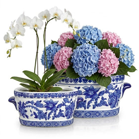 Arborus blue and white ceramic planter oval cachepot, front view, ideal for indoor floral display.
