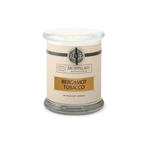 Archipelago Botanicals Bergamot Tobacco glass jar candle releasing a crisp, inviting scent in any room