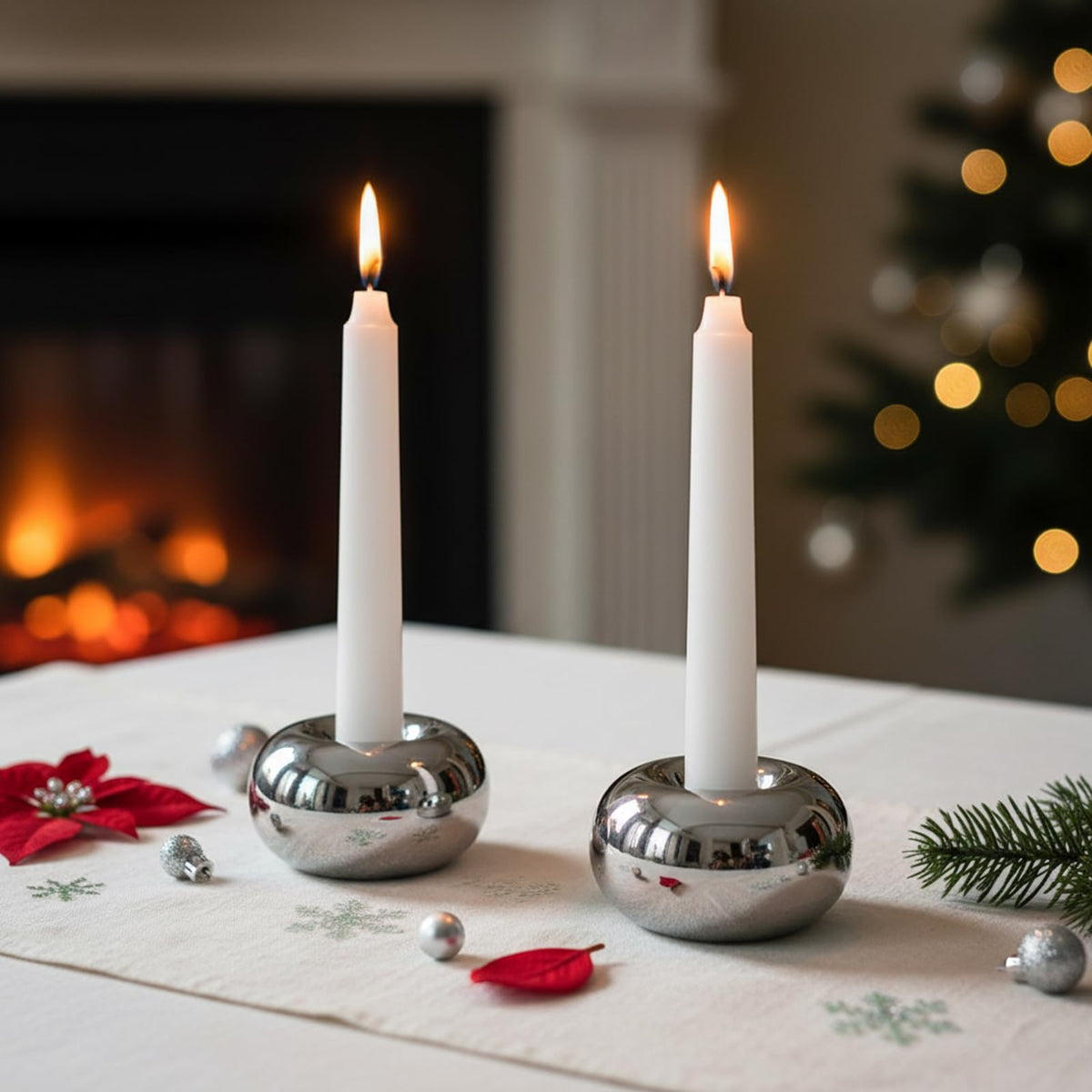 Ardax silver doughnut candlestick holder on living room table, reflective finish.