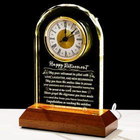 Arikyrist glass retirement clock on a wooden base for an elegant desk display
