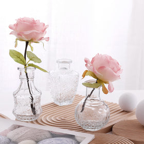 Arme rustic-wedding decor vases enhance guest tables with vintage flair.