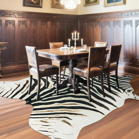 AROGAN zebra rug bedroom arrangement adds texture and a bold monochrome accent.