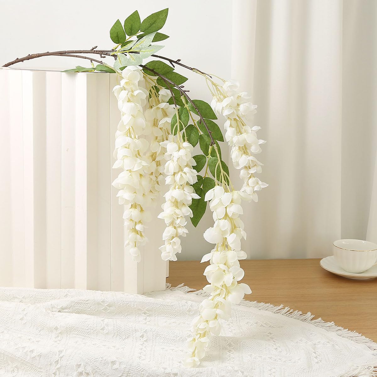 AROIUO wisteria garland pink creates romantic table accents.