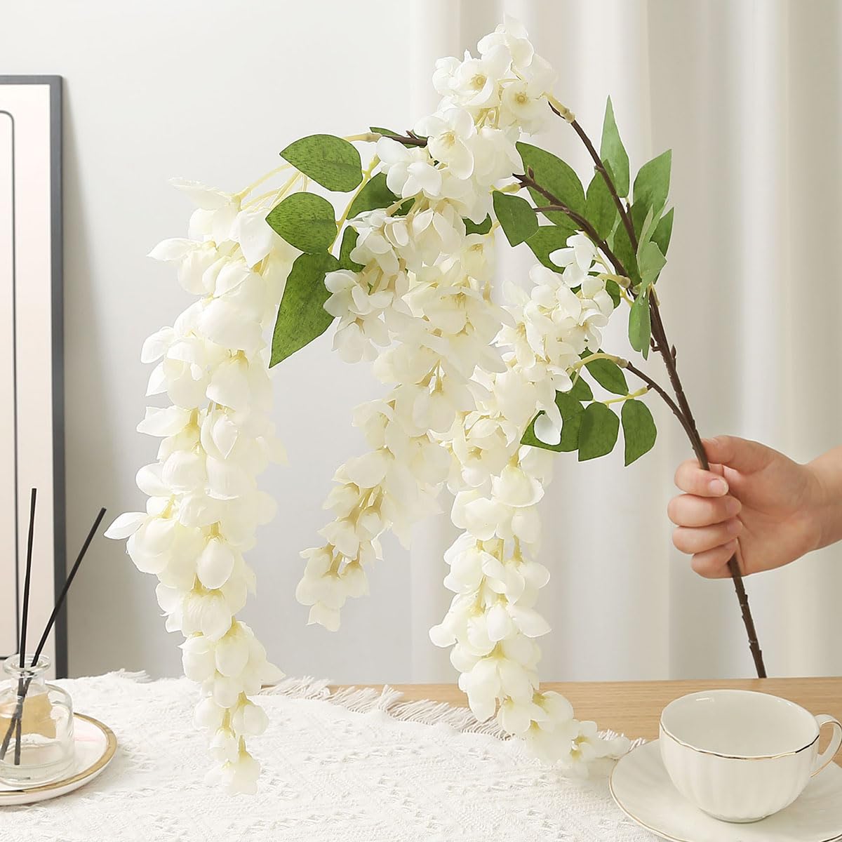 AROIUO wisteria garland wall decor adds depth.