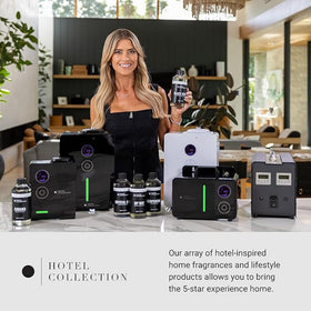 Aroma360 luxury diffuser oil on a table enhances hotel-inspired ambience.