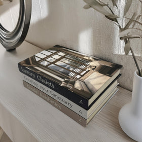 Array & Arrow books displayed on a shelf, versatile props for staging.