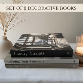 Array & Arrow faux books on coffee table create a timeless neutral accent.