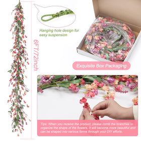 Artgar garland closeup reveals handmade texture of leaves and paper petals.