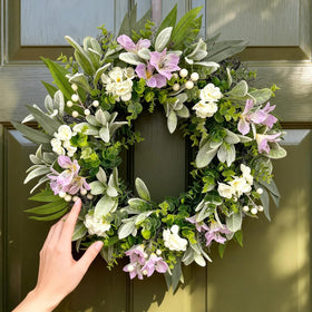 ARTINCRAFIO 24inch pastel purple and white eucalyptus wreath on front door for year-round curb appeal.