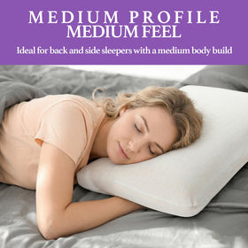Artka Talalay latex pillow in bed with soft queen mid-loft bounce.