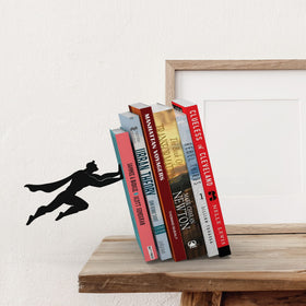 Artori Design superhero bookends on a shelf showcasing organized collection