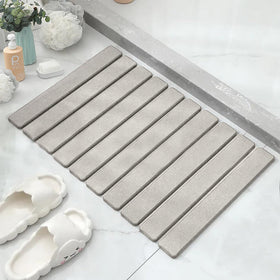 Asou Stone Bath Mat with diatomaceous-earth-absorbent surface dries floors.