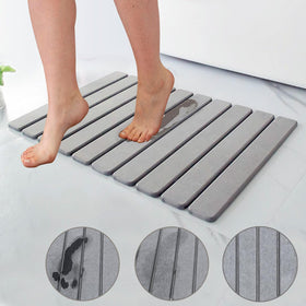 Asou Stone Bath Mat non-slip texture improves safety on wet floors.