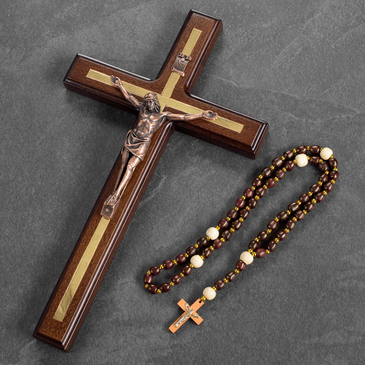 Asterom crucifix with copper-plated Jesus showcases detailed craftsmanship.