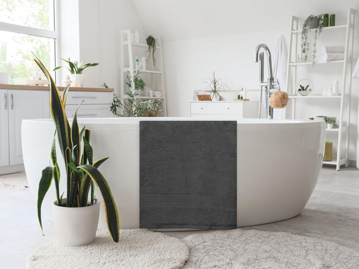 ASTILTEX charcoal grey 24x50 towel in use for full-body drying and comfort.