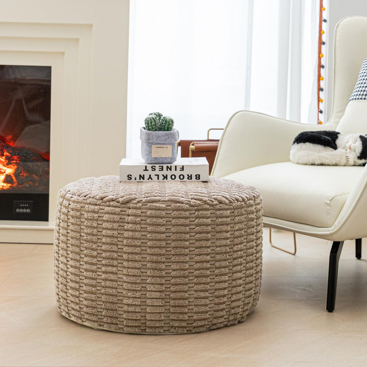 Asuprui pouf ottoman plush fabric close-up highlights soft texture and durable fill.
