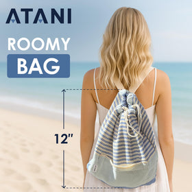 ATANI Turkish Beach Towel folded compact in a bag for travel.