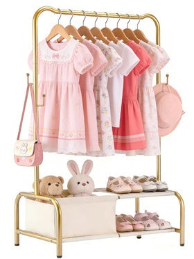Atrastout Kids Clothing Rack gold side view highlights sturdy metal frame for active toddlers.