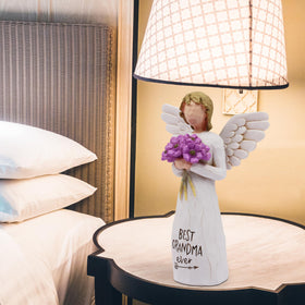 AUKEST Resin grandmother sculpture with floral accents, durable keepsake for any room.