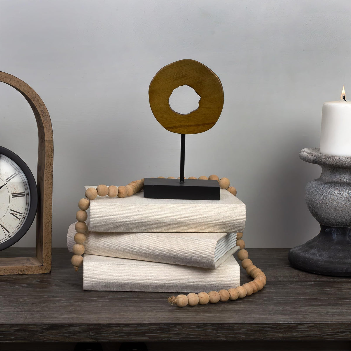AuldHome Design faux book stack on mantel enhances cozy shelf decor
