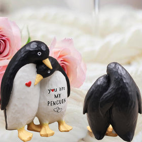 AUMELO close-up engraving detail, showing the loving couple motif on resin finish.