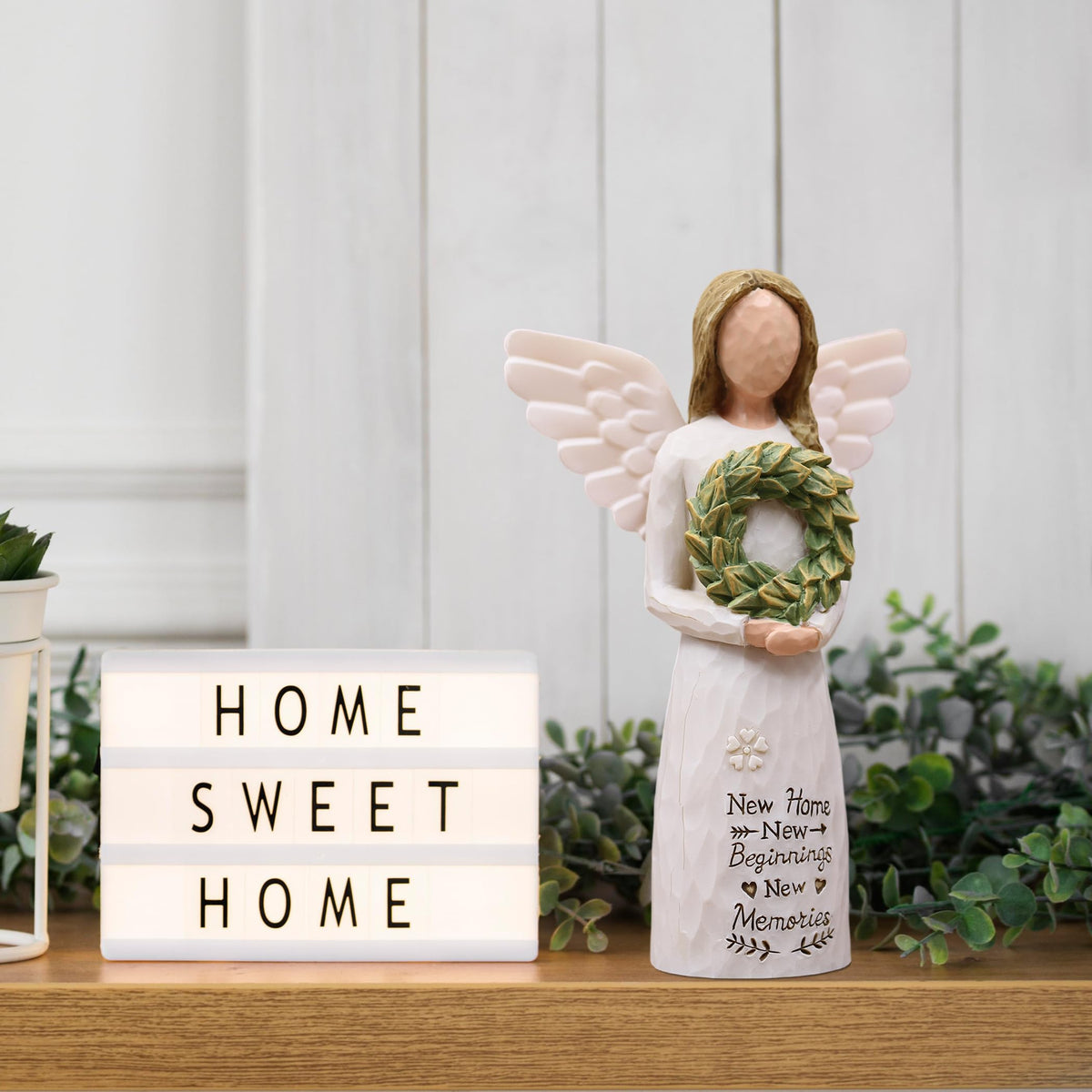 AUMELO resin angel detail robe highlights artistry for modern or rustic interiors