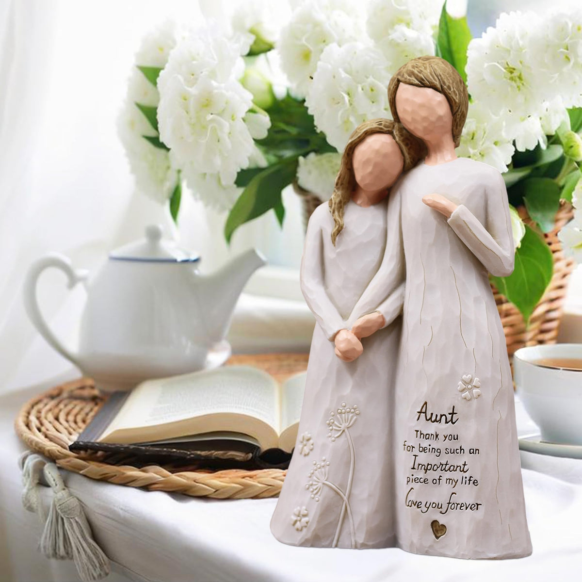 AUMELO Ivory Resin Aunt Figurine brightens a desk or shelf.