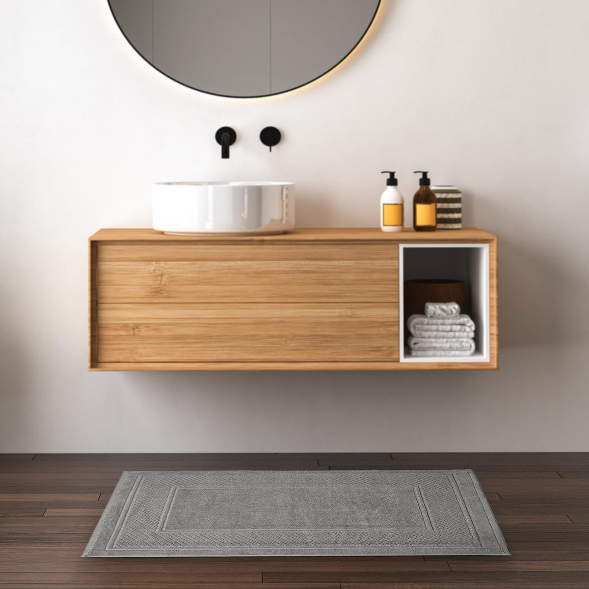 Avalon Towels grey bath mat with durable stitching maintains plush look