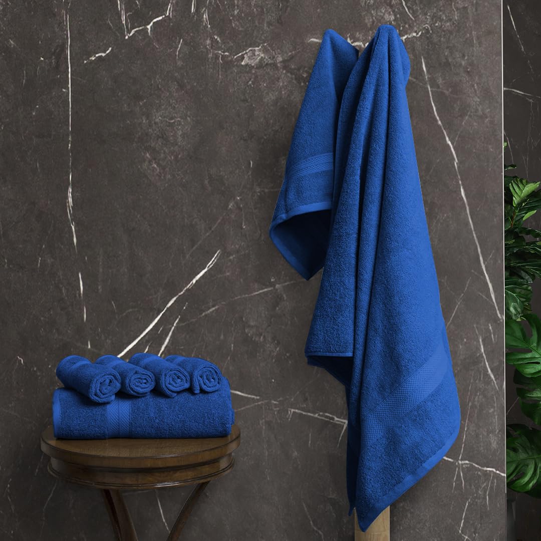 Avalon Towels royal blue bath towels drape neatly, signaling premium comfort.