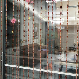 ave split room divider beaded curtain shows soft separation between living areas