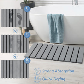 AWW Foldable Stone Bath Mat close-up on diatomaceous earth surface absorbing water.