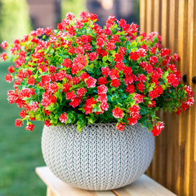 AXYLEX red outdoor faux flowers brighten front porch without maintenance.