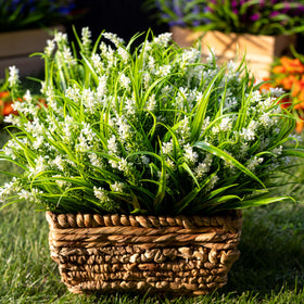 AXYLEX faux monkey grass privacy accents enhance balcony seclusion.