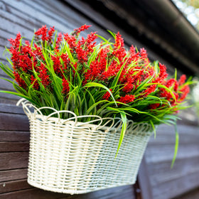 AXYLEX monkey grass plastic provides lush green contrast with lavender blooms.