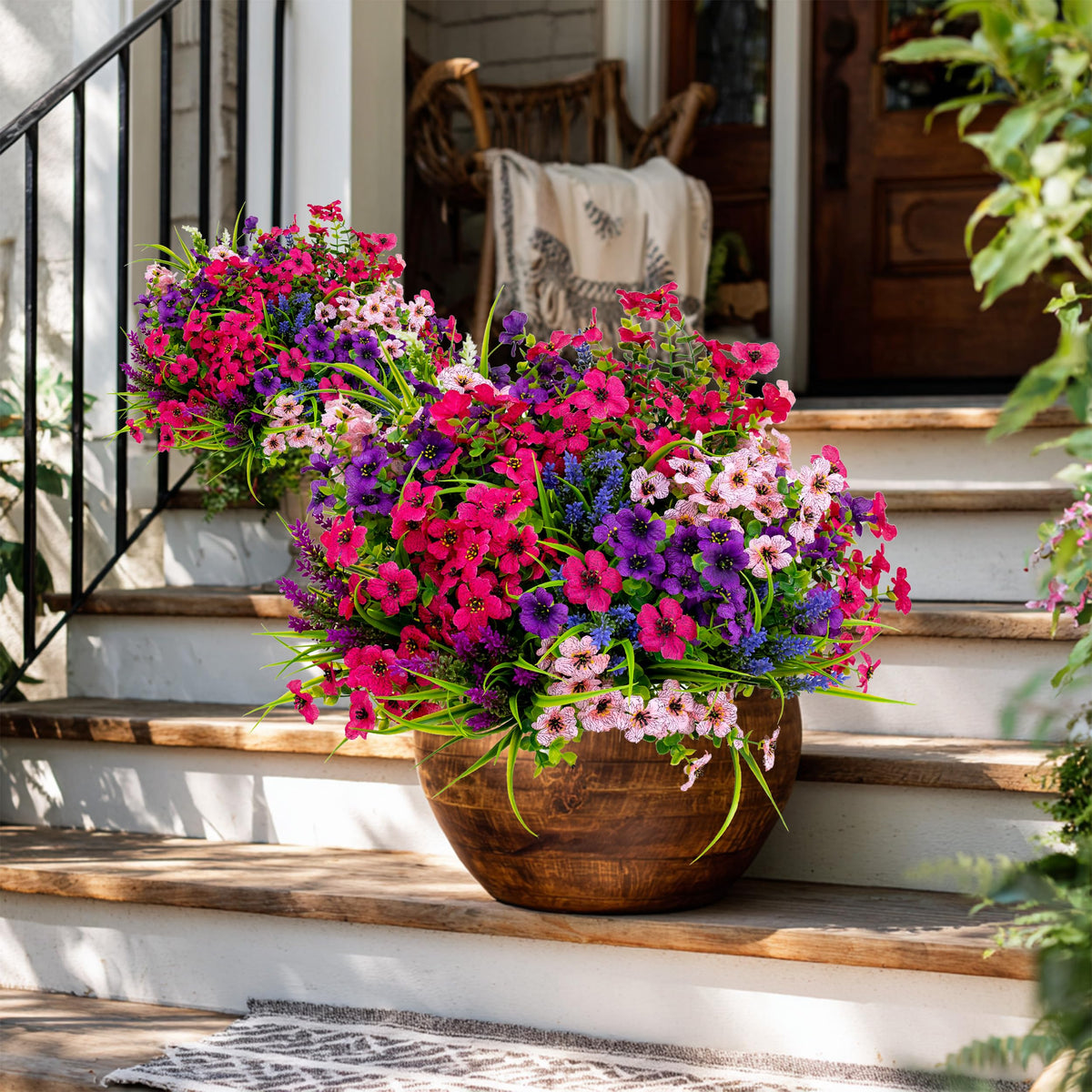 AXYLEX outdoor faux shrubs create depth and privacy on a deck