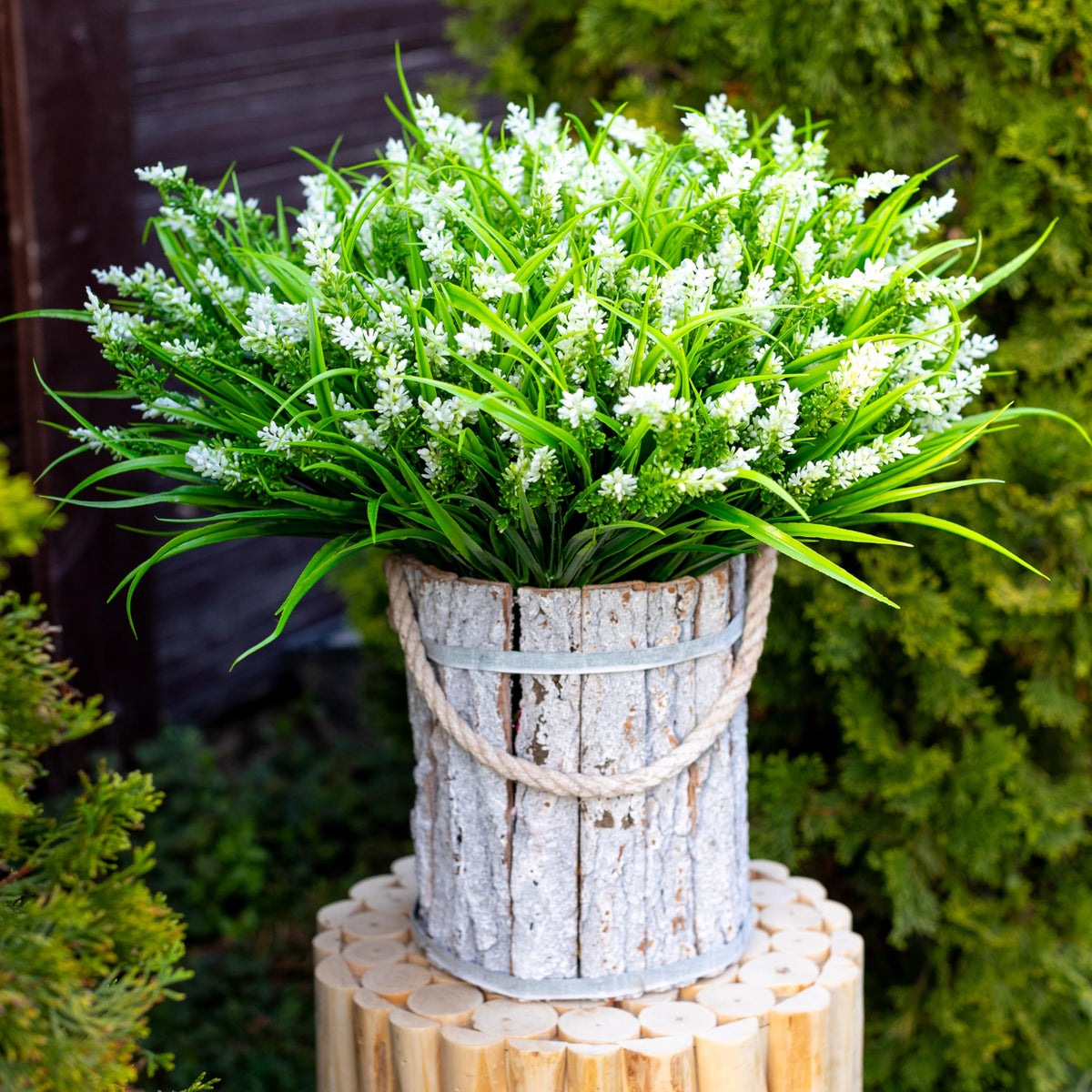 AXYLEX privacy-creating fake flowers help screen ground-floor windows.