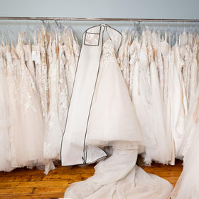 Azure Aster Bridal bag in use with a wedding gown in a closet