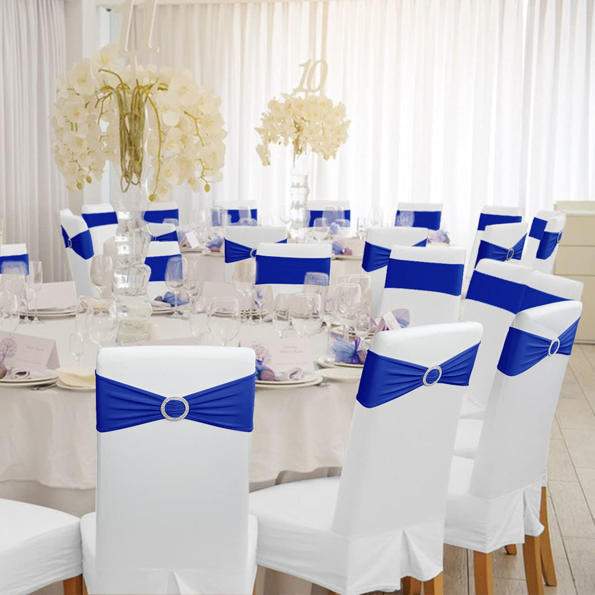Babenest royal blue chair sash enhances wedding aesthetic and decor.