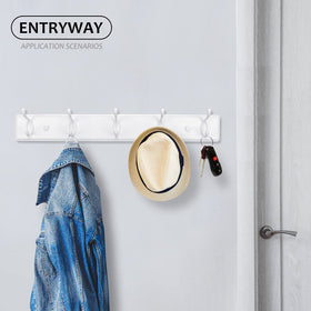 White finish on Badiano rack adds minimalistic elegance to a bedroom.